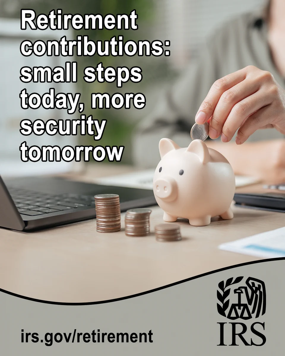 A person placing a coin into a light-colored piggy bank on a desk. Several stacks of coins sit beside the piggy bank, with an open laptop visible in the background. Text reads: “Retirement contributions: small steps today, more security tomorrow.” Website at the bottom “irs.gov/retirement” alongside the IRS logo.